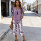 🥳2026 HOT SALE🥳💞50K+ SOLD!💕🌿 50% OFF! 2-Piece Tunic & Wide Leg Pants Set – No matching hassle, instantly chic. Layered asymmetrical top, leaf-print capri pants. Sizes S-5XL. Your new favourite. 👖✅