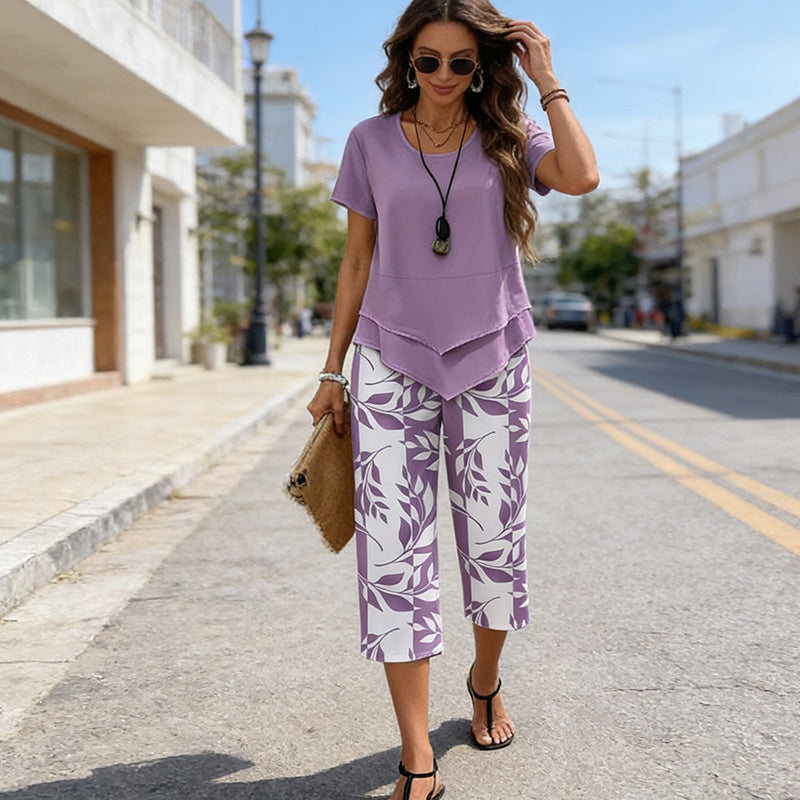 🥳2026 HOT SALE🥳💞50K+ SOLD!💕🌿 50% OFF! 2-Piece Tunic & Wide Leg Pants Set – No matching hassle, instantly chic. Layered asymmetrical top, leaf-print capri pants. Sizes S-5XL. Your new favourite. 👖✅
