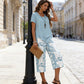 🥳2026 HOT SALE🥳💞50K+ SOLD!💕🌿 50% OFF! 2-Piece Tunic & Wide Leg Pants Set – No matching hassle, instantly chic. Layered asymmetrical top, leaf-print capri pants. Sizes S-5XL. Your new favourite. 👖✅