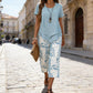 🥳2026 HOT SALE🥳💞50K+ SOLD!💕🌿 50% OFF! 2-Piece Tunic & Wide Leg Pants Set – No matching hassle, instantly chic. Layered asymmetrical top, leaf-print capri pants. Sizes S-5XL. Your new favourite. 👖✅