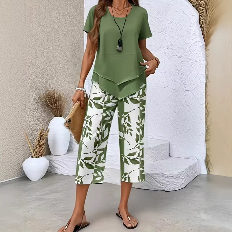 🥳2026 HOT SALE🥳💞50K+ SOLD!💕🌿 50% OFF! 2-Piece Tunic & Wide Leg Pants Set – No matching hassle, instantly chic. Layered asymmetrical top, leaf-print capri pants. Sizes S-5XL. Your new favourite. 👖✅