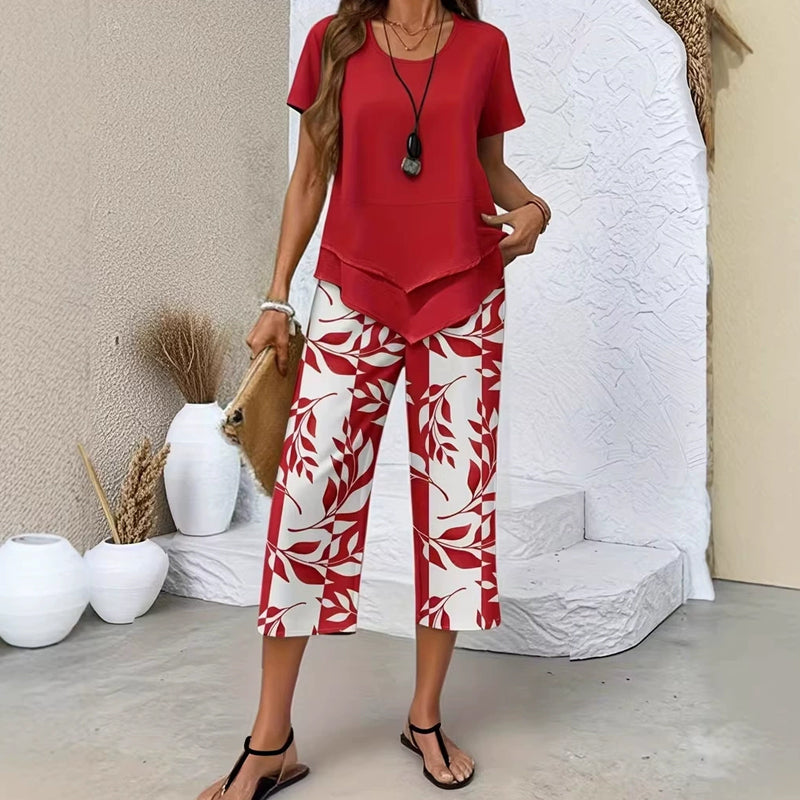 🥳2026 HOT SALE🥳💞50K+ SOLD!💕🌿 50% OFF! 2-Piece Tunic & Wide Leg Pants Set – No matching hassle, instantly chic. Layered asymmetrical top, leaf-print capri pants. Sizes S-5XL. Your new favourite. 👖✅
