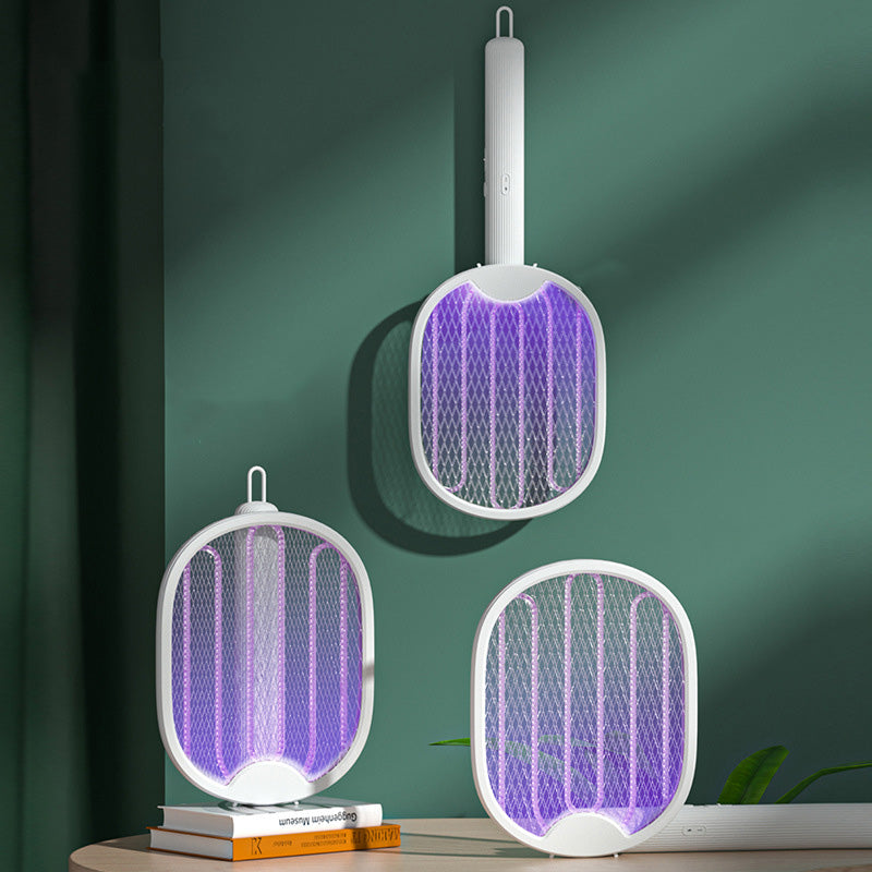 🥳2026 HOT SALE🥳💞50K+ SOLD!🦟⚡ 50% OFF! 2‑in‑1 Foldable Mosquito Swatter – Manual zap + UV auto trap. USB rechargeable, folds flat for storage. Sleep bite‑free tonight! 🌙✨