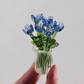 🥳2026 HOT SALE🥳💞50K+ SOLD! 🎁✨ 50% OFF! Mini Glass Bouquet – 6cm tall, 7 glass flowers + vase, never withers. Elegant gift for home & office! 🏠💚
