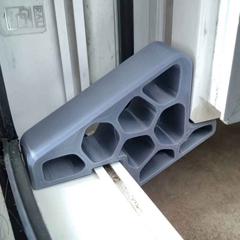 🥳2026 HOT SALE🥳💞50K+ SOLD! 🚪✨ BUY 1 GET 1 FREE! Secure Track Door Stop – Absorbs impact, reduces slamming & protects rails. Compact locking design – fits sliding windows & balcony doors! 🛡️🔇
