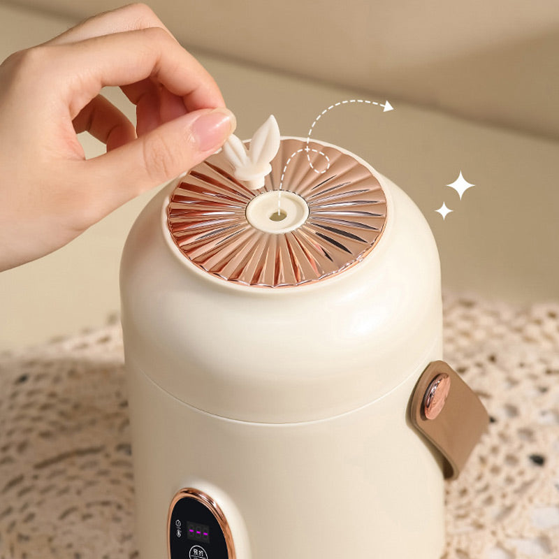 🥳2026 HOT SALE🥳💞50K+ SOLD! 🍲⏰ 50% OFF! Portable Electric Stewpot – 900ml, 9-hour reservation, 5 heat levels. Non-stick, hidden plug, anti-slip base. Cooks rice, soup & porridge – perfect for 1-2 people or travel! 🏠✅